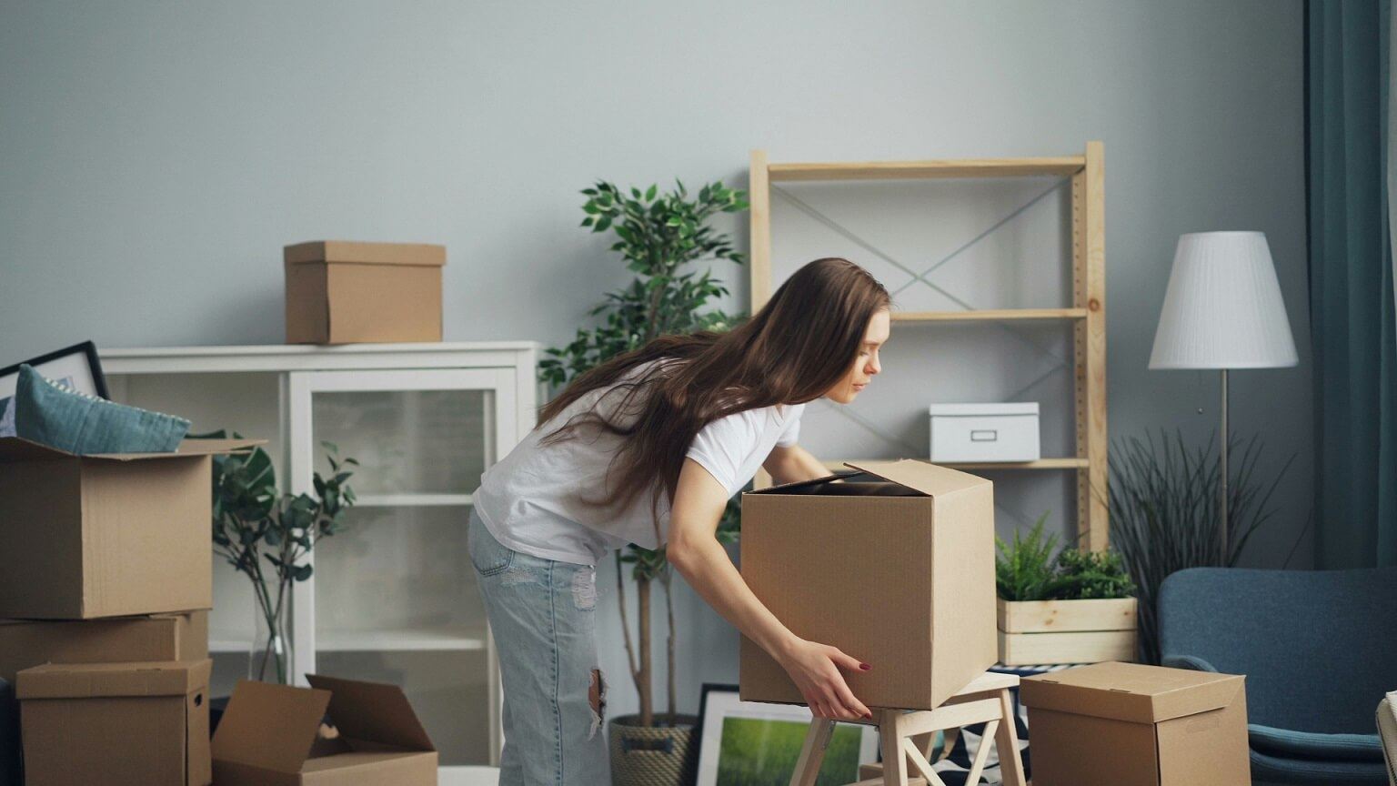 Woman moving box