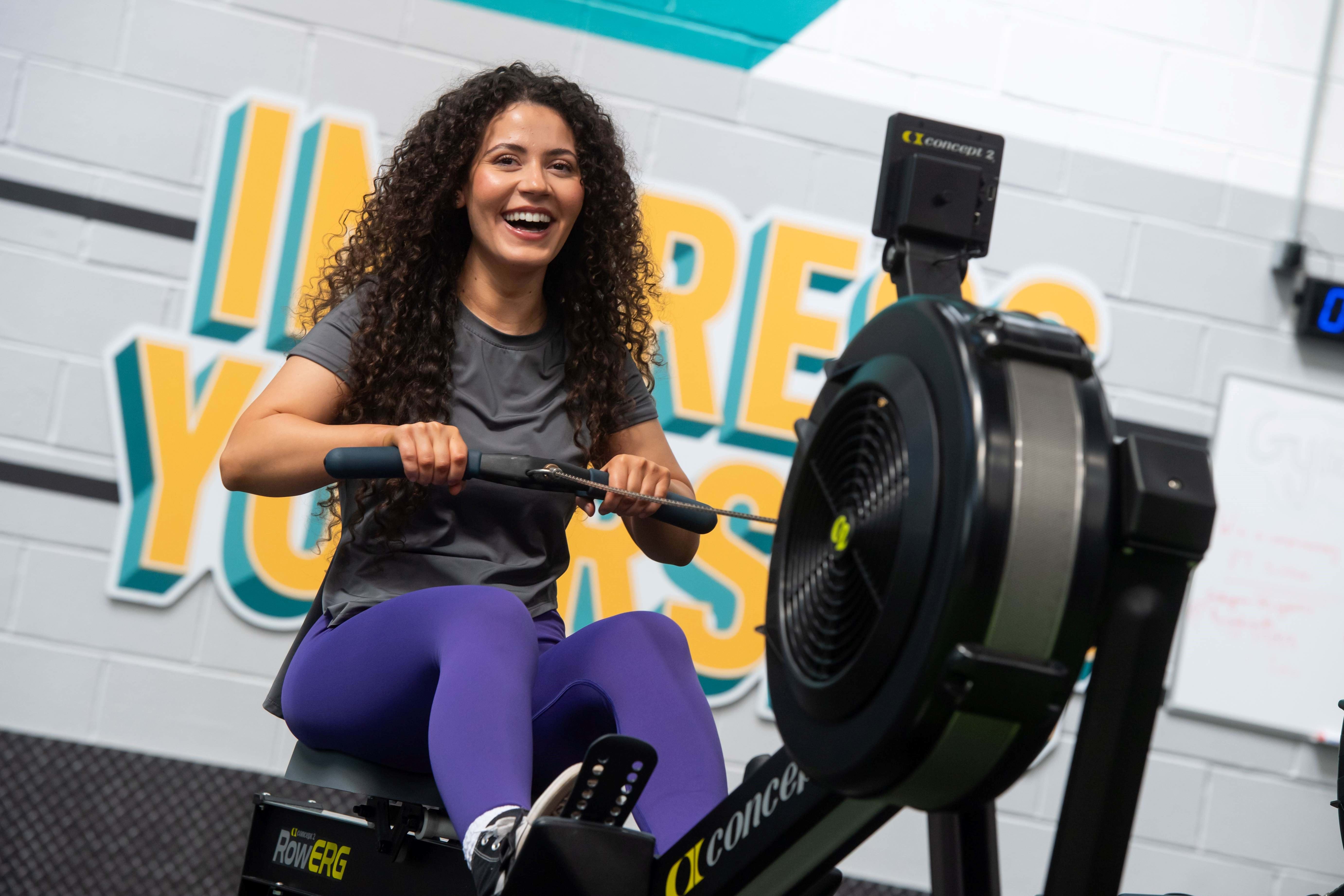 man on rowing machine