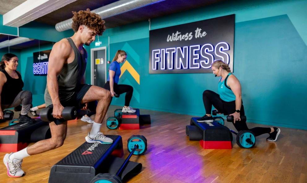 PureGym members and instructor taking part in a Step class